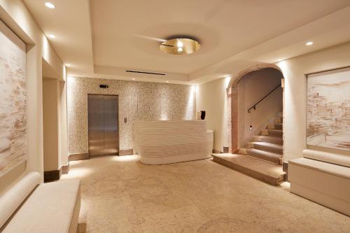 a hallway with a staircase in a building at Hotel Dei Dragomanni in Venice