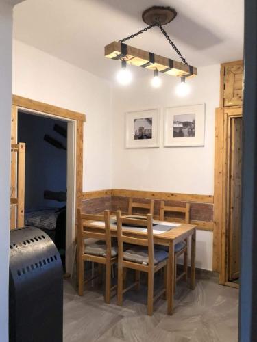 a dining room with a table and chairs at Amur Vendégház in Gárdony