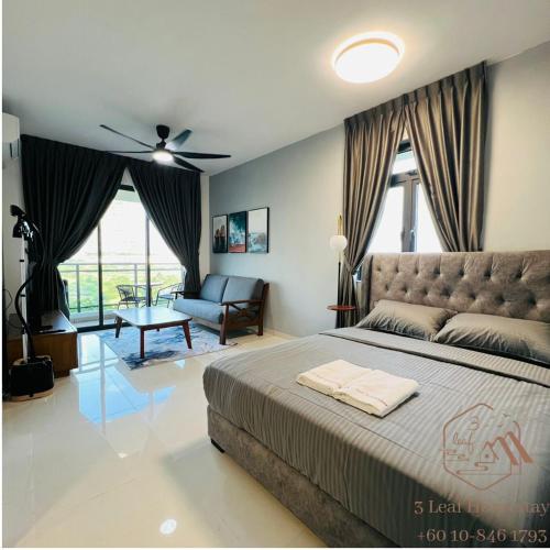 a bedroom with a bed and a living room at GELANG PATAH Forest City-Ataraxia Park 3 in Gelang Patah