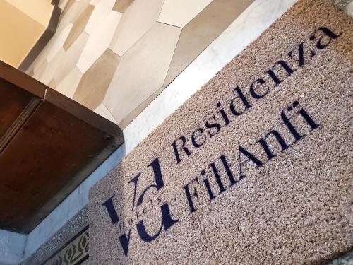 a sign on the side of a building at Residenza FillAnfi in Lucca