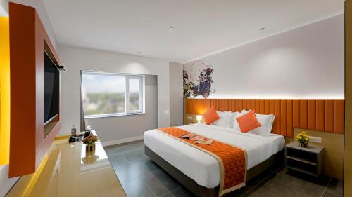 a bedroom with a large bed and a window at Hotel City Keys By Rivido, Electronic City in Bangalore
