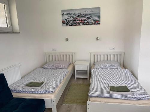 two twin beds in a room with at Privát SIMBA in Strečno