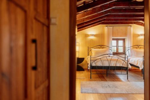 Ένα ή περισσότερα κρεβάτια σε δωμάτιο στο Meneghetti Wine Hotel and Winery - Relais & Chateaux