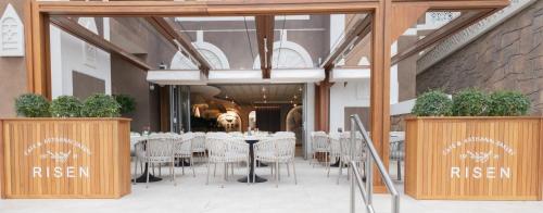 a dining room with tables and chairs in a building at Wyndham Residences The Palm in Dubai