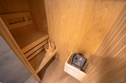 an overhead view of a wooden sauna with a bench at Mandachi Hotel & SPA in Suceava