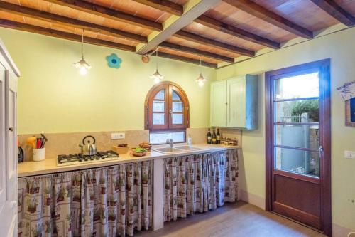 a kitchen with a sink and a counter top at Iesa - Relax nella campagna di Siena in Lama