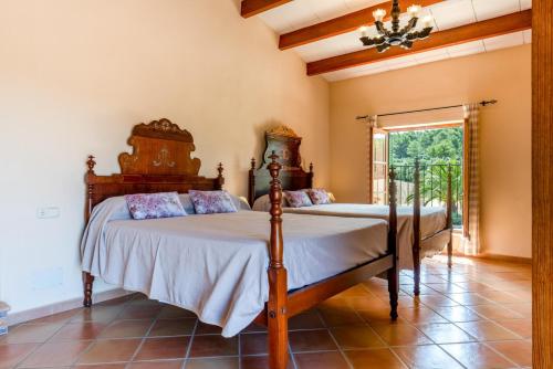 a bedroom with two beds in a room at Cases de Son Roig in Sant Joan