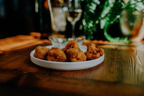a plate of fried food on a table at Młyn Jacka Hotel & Spa in Wadowice