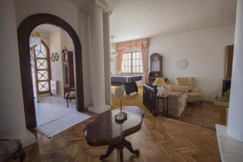 a living room with a table and a piano at Catalunya Casas Close to Salou and just steps from the village! in Alcover