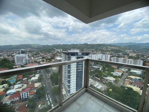 a balcony with a view of a city at Cebu One Pavillion Place by P&J in Cebu City