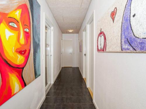 a hallway with paintings on the walls at Luxury Retreat in Vorupor - By Traum Ferienwohnungen in Snedsted