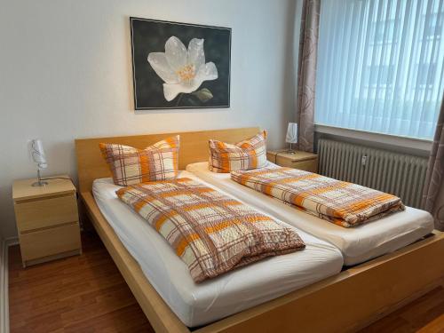 Postel nebo postele na pokoji v ubytování Ferienwohnungen Meeres-Brise - Weißer Weg