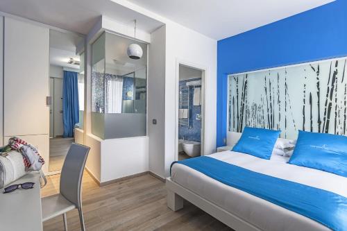 Postel nebo postele na pokoji v ubytování JC Hotel
