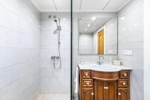 a bathroom with a sink and a shower at La Gimena in Orihuela