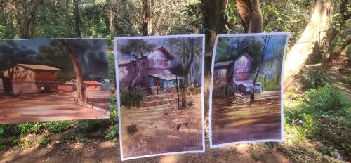 three paintings of a house in the woods at Hotel Hilltone- panorama bungalow matheran in Matheran