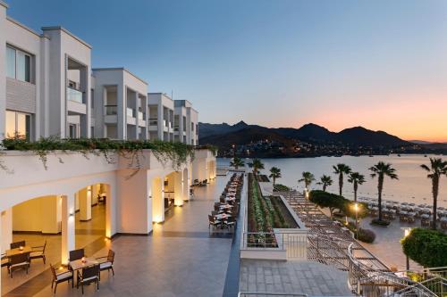 a view of a building with a view of the water at Xanadu Island in Akyarlar