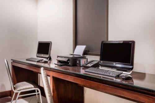 a desk with a laptop computer and a printer at Wyndham Garden San Jose Escazu, Costa Rica in San José