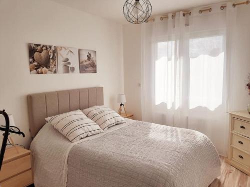 Ένα ή περισσότερα κρεβάτια σε δωμάτιο στο Comme à la maison
