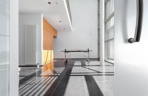 an empty room with a table in the middle of it at Super Luxurious Villa - 600m² - Up to 22 people in Edipsos