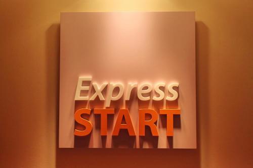 a sign with the words express start on a wall at Holiday Inn Express Birmingham Redditch by IHG in Redditch