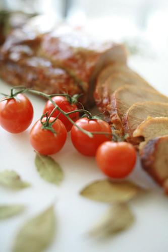 a plate of food with tomatoes on a table at Holiday Inn Express Birmingham Redditch by IHG in Redditch