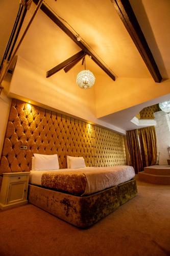a bedroom with a large bed in a room at The Dixie Dean Hotel in Liverpool