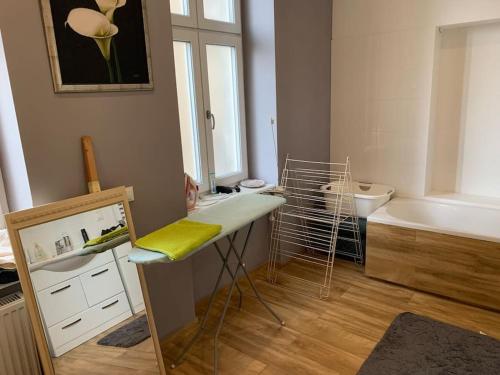 a bathroom with a tub and a sink and a counter with a sink at 3 Bedroom Lux Apartment Center in Wrocław