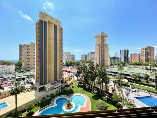 a view of a city from a building with a pool at Torpa - Aloturin Benidorm in Benidorm