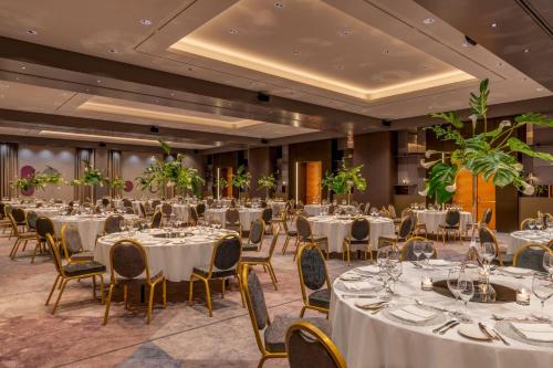 a banquet hall with white tables and chairs at Vienna Marriott Hotel in Vienna
