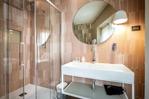 a bathroom with a sink and a shower at Hotel Duomo Firenze in Florence