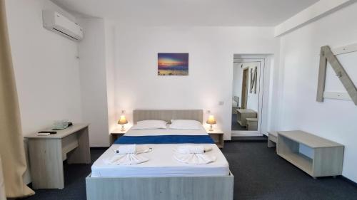 Postel nebo postele na pokoji v ubytování Neptun Resort