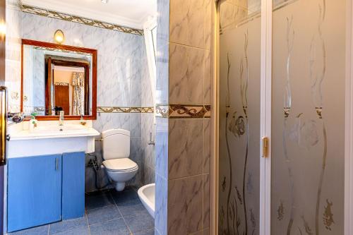 a bathroom with a toilet and a sink and a shower at Sharm and Charme at Sharm El Sheikh in Sharm El Sheikh