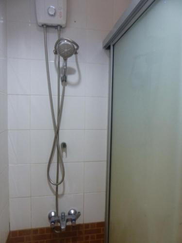 a shower with a shower head in a bathroom at View Talay 2 A in Jomtien Beach