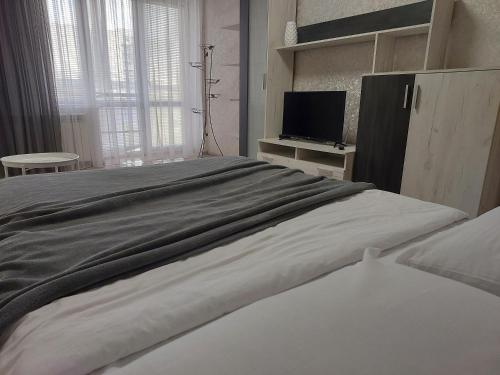 Postel nebo postele na pokoji v ubytování Апартаменти Молоді LutskDoba