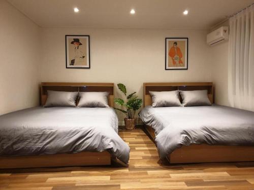 Postel nebo postele na pokoji v ubytování Complace D