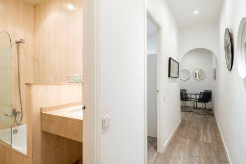 a bathroom with a sink and a mirror at Two bedroom flat in PobleNou in Barcelona