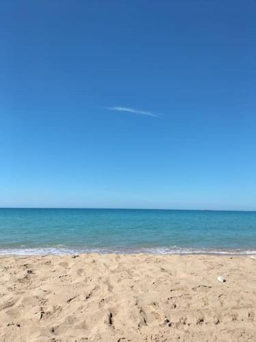 a sandy beach with the ocean in the background at Casa Vacanze Villa Eolo in Agrigento