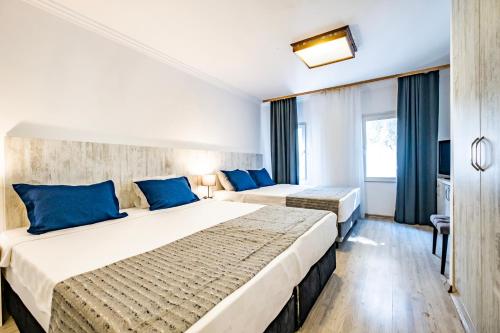 Katil atau katil-katil dalam bilik di Costa Bodrum City