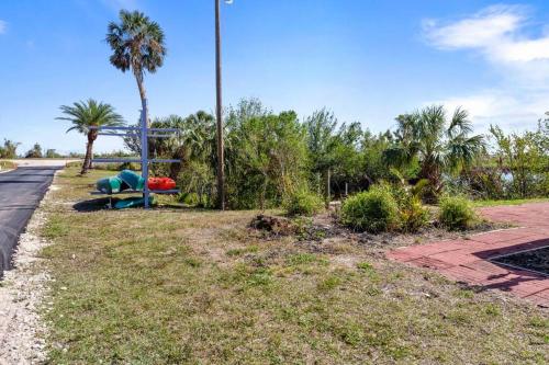 a park with palm trees on the side of a road at Waterfront Condo #9 in Punta Gorda