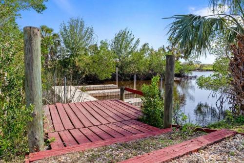 a wooden dock next to a body of water at Waterfront Condo #9 in Punta Gorda