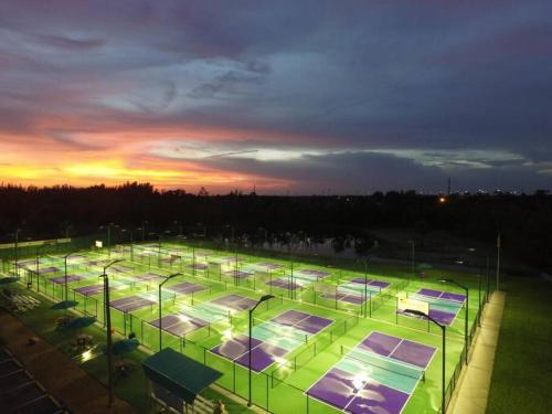 a large tennis court with many tennis courtsitures at Waterfront Condo #7 in Punta Gorda