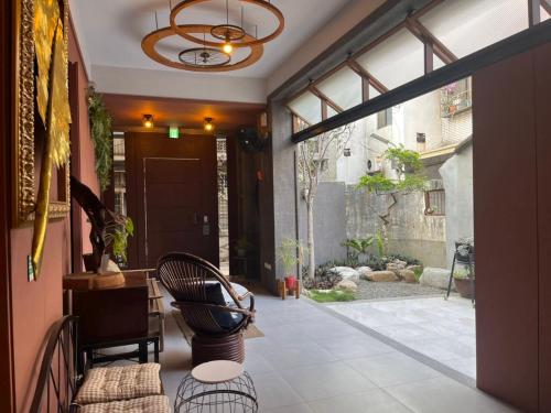 a living room with a large glass door and a patio at Fu's house 52 in Tainan