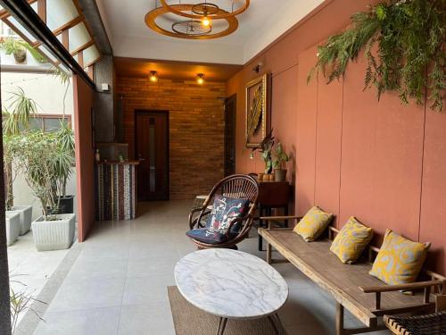 a patio with a bench and a table at Fu's house 52 in Tainan