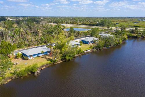 an aerial view of a house next to a river at Beautiful Waterfront 1 bedroom #4 in Punta Gorda