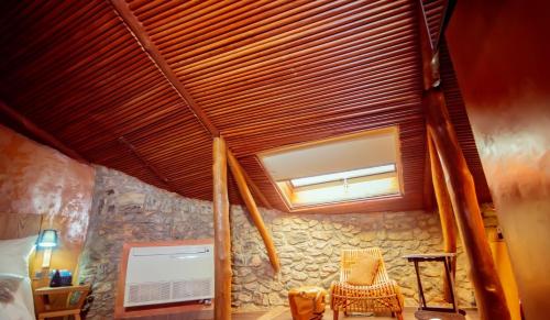 a room with a bed and a window and surfboards at Trois Ore Residences & Green Earth Bistro in Ibadan