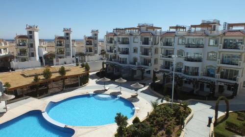 an aerial view of a large apartment complex with a swimming pool at Sharm Hills Resort in Sharm El Sheikh