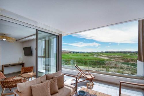 a living room with a large window with a view at Kube Taghazout - Luxe - 5Px in Taghazout