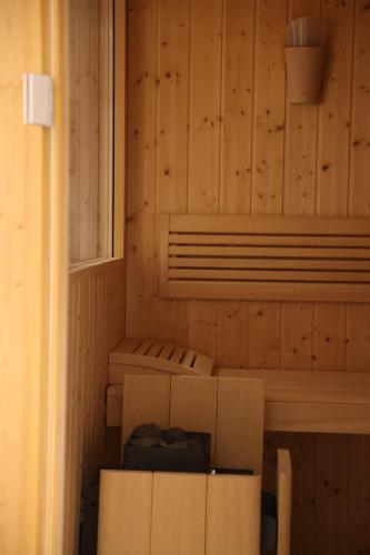 a room with boxes in a room with wooden walls at Hotel Hofwirt Neubeuern in Neubeuern