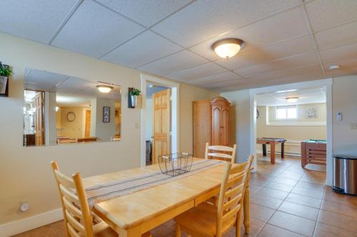 a dining room with a wooden table and chairs at Cozy Historic Home with Games, Near Bryce Canyon! in Cannonville