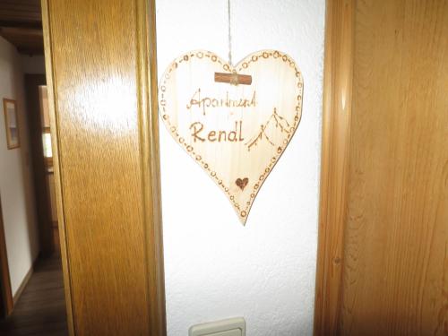 a heart shaped sign on the wall of a room at Apartment Hof am Schönbach-2 by Interhome in Sankt Jakob